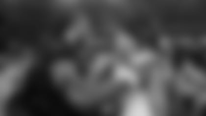 After the game, Arizona's Larry Fitzgerald and Seattle's Russell Wilson chat at midfield.