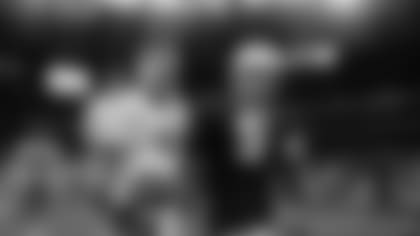 Damon and Brock Huard walk off the field after the Seahawks lost to the Dolphins in the Wild Card round on January 9, 2000. This was the final game played in the Kingdome. (Photo courtesy of Tacoma News Tribune)