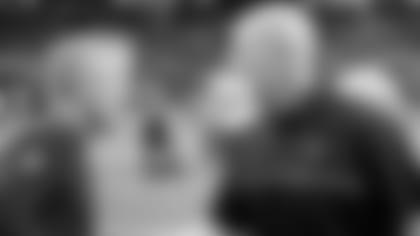 FILE - In this Jan. 14, 2017, file photo, Seattle Seahawks coach Pete Carroll, left, speaks with Atlanta Falcons coach Dan Quinn before an NFL football NFC divisional playoff game in Atlanta. Quinn says he never backs down from a challenge. Just in time for a visit from his mentor, Seattle coach Carroll, Quinn is facing the biggest challenge of his career. Quinn’s Falcons will try to stop a five-game losing streak when they face the Seahawks on Sunday. (AP Photo/David Goldman, File)