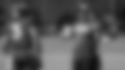 Denver Broncos quarterback Russell Wilson (3) cahts with head coach Nathaniel Hackett during an NFL football training camp session at the team's headquarters Monday, Aug. 8, 2022, in Centennial, Colo. (AP Photo/David Zalubowski)