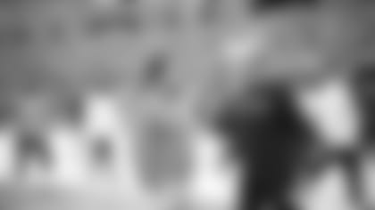 Seahawks general manager John Schneider and head coach Pete Carroll talk on the field before the game.