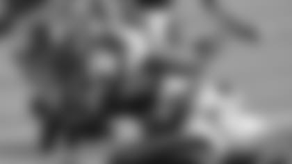 Carolina Panthers running back Christian McCaffrey (22) is tackled by Seattle Seahawks middle linebacker Bobby Wagner (54) and outside linebacker K.J. Wright (50) during the first half of an NFL football game in Charlotte, N.C., Sunday, Dec. 15, 2019. (AP Photo/Mike McCarn)