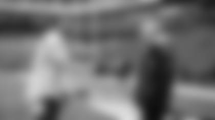 New Seahawk Adrian Colbert chats with head coach Pete Carroll on the field hours before kickoff.