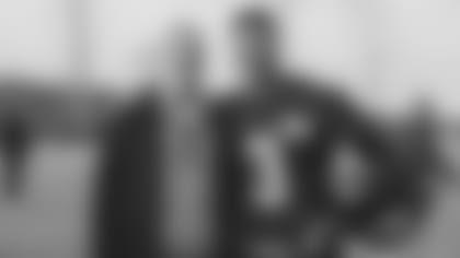 Seattle Storm star Sue Bird poses with Russell Wilson during a Seahawks practice in 2017.