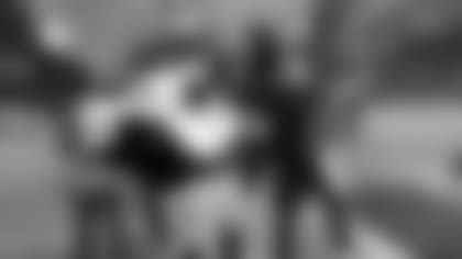 Seattle Seahawks' Richard Sherman, right, trades jerseys with Oakland Raiders' Charles Woodson after an NFL football game, Sunday, Nov. 2, 2014, in Seattle. The Seahawks won 30-24. (AP Photo/Elaine Thompson)