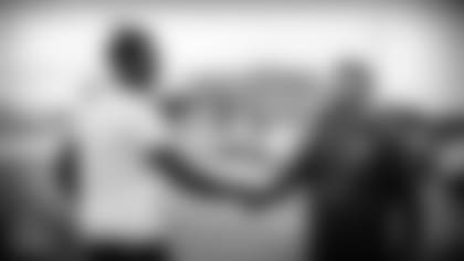 NASHVILLE, TN - JUNE 07, 2021 - Julio Jones greets General Manager of the Tennessee Titans Jon Robinson in Nashville, TN. Photo By Donald Page/Tennessee Titans