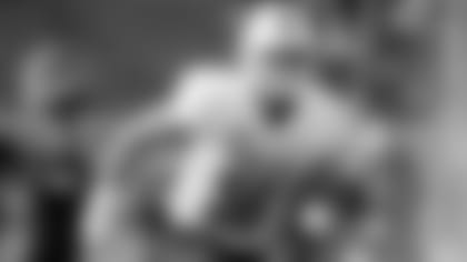 Wisconsin's Zack Baun lines up as the North squad runs drills during practice for the Senior Bowl Wednesday, Jan. 22, 2020, in Mobile, Ala. (AP Photo/Butch Dill)