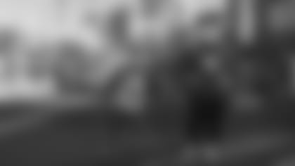 Jackson DeLude, 8, and his mom, Ashley, walk down Sunset Boulevard at Disney’s Hollywood Studios at Walt Disney World Resort in Lake Buena Vista, Fla., Dec. 11, 2020, to celebrate Jackson’s new prosthetic legs. (Matt Stroshane, photographer)