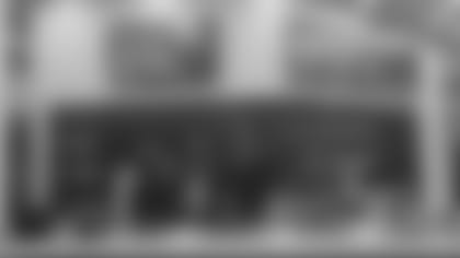 Tyaira, Sean and Tim from Who's Yo' Daddy BBQ pose at Twin Cities Orthopedics Performance Center.