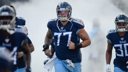 Taylor Lewan gets his first look at the Titans new uniforms