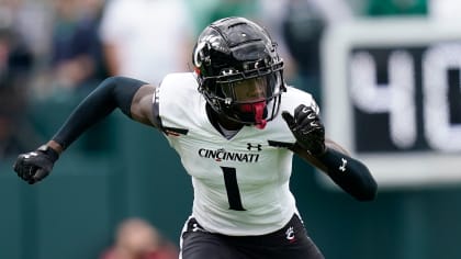 Cincinnati cornerback Ahmad Sauce Gardner holds up a jersey for