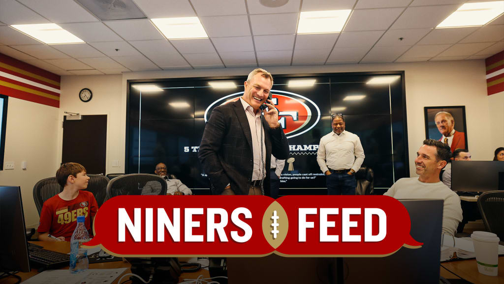 San Francisco 49ers first-round pick Nick Bosa, center, holds up a jersey  next to general manager John Lynch, left, and coach Kyle Shanahan, right,  during an NFL football news conference, Friday, April