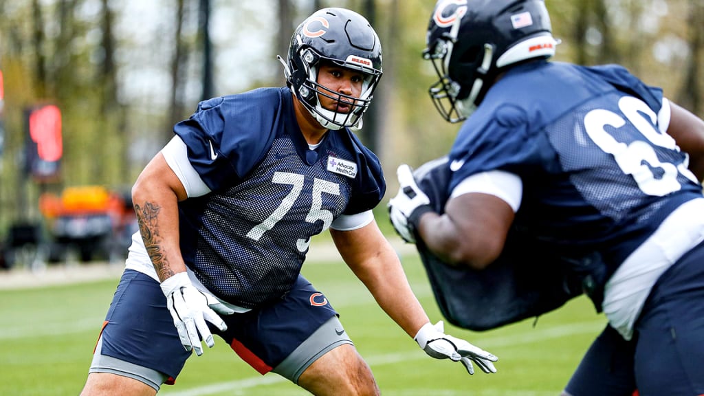 Chicago Bears offensive tackle Larry Borom (75) runs on the field during  the first half of