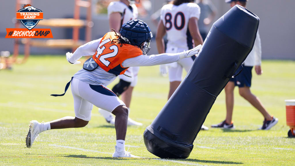 Denver Broncos linebacker Nik Bonitto walks off the field after a