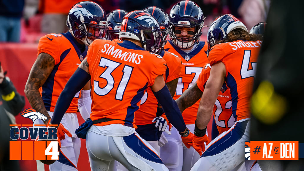 DENVER, CO - DECEMBER 18: Denver Broncos cornerback Pat Surtain II (2) goes  up to grab an interception during an NFL game between the Arizona Cardinals  and the Denver Broncos on December