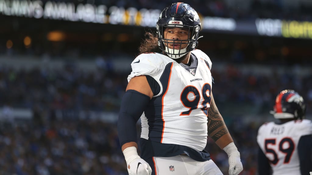 Denver Broncos defensive lineman Mike Purcell takes part in drills