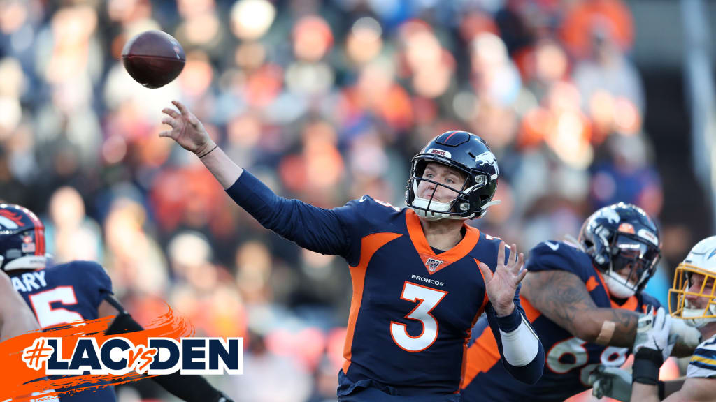 Drew Lock of the Denver Broncos carries the ball ahead of Derrick