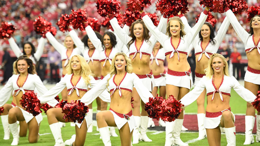 An Arizona Cardinals cheerleader performs at the two minute