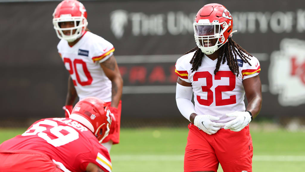 Kansas City Chiefs linebacker #32 Nick Bolton returns the ball to