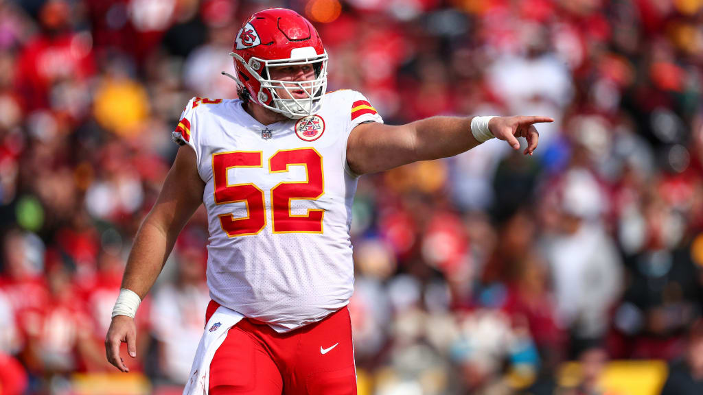 Kansas City Chiefs center Creed Humphrey (52) gets set on the line during  an NFL football