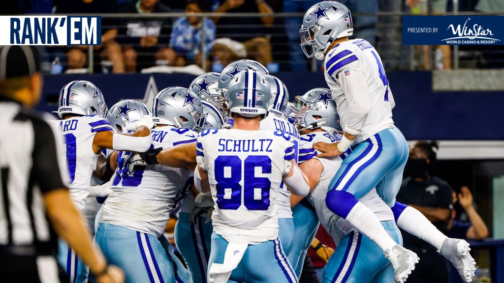 Dallas Cowboys' Micah Parsons (11), Trevon Diggs (7) and Damontae Kazee  (18) celebrate after Diggs made a interception on a pass thrown by Carolina  Panthers' Sam Darnold in the second half of