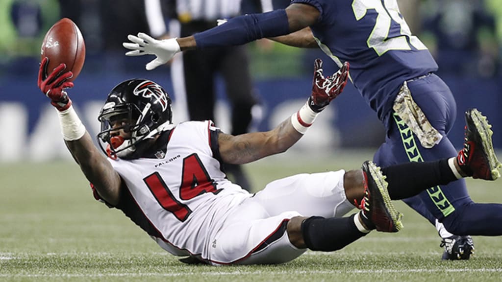 Atlanta Falcons wide receiver Justin Hardy (14) celebrates with Mohamed  Sanu (12) after his 5-yard touchdown pass over the Arizona Cardinals during  the second half of an NFL game at Mercedes-Benz Stadium