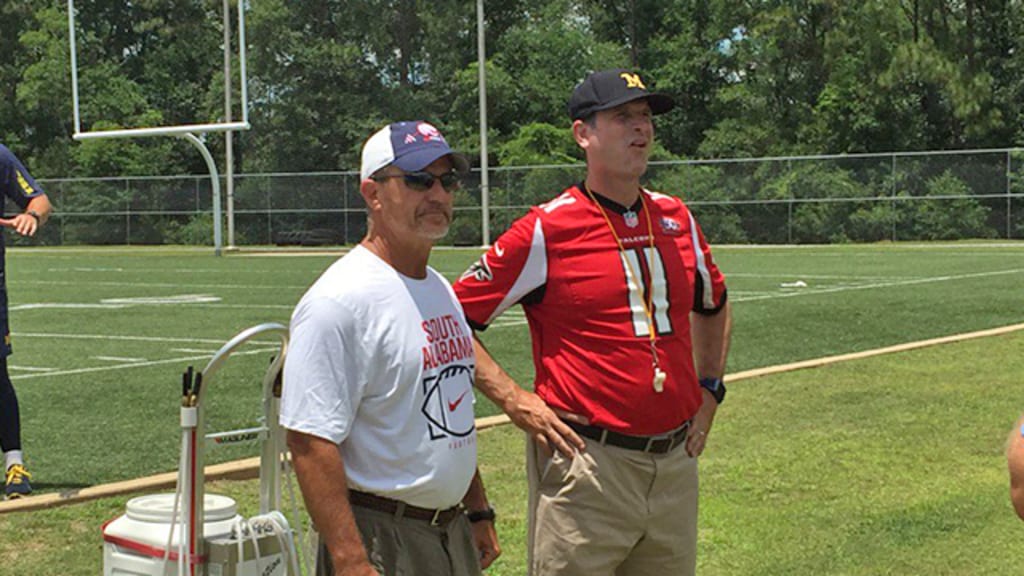 UM Coach Harbaugh Reps Falcons' Jones Jersey