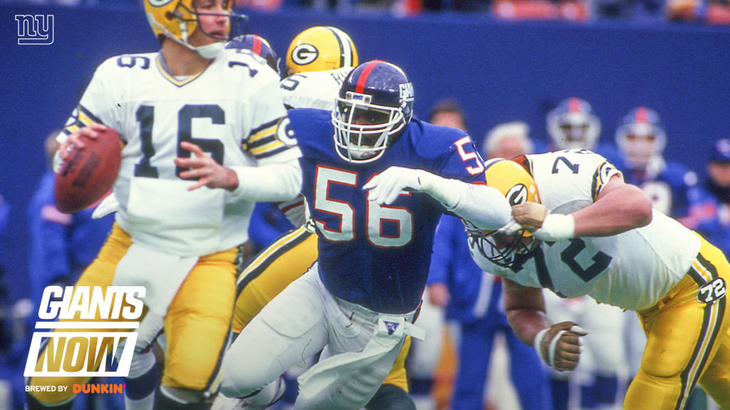 Former New York Giants player Lawrence Taylor waves to fans during a  half-time ceremony at an NFL football game between the Giants and the  Carolina Panthers, Sunday, Dec. 27, 2009, in East