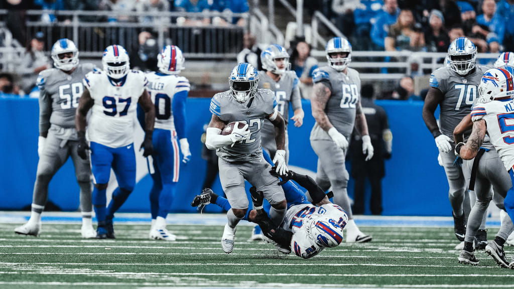 DETROIT, MI - NOVEMBER 24: The Detroit offensive players huddle together as  a play is called during a regular season NFL football game between the  Buffalo Bills and the Detroit Lions on