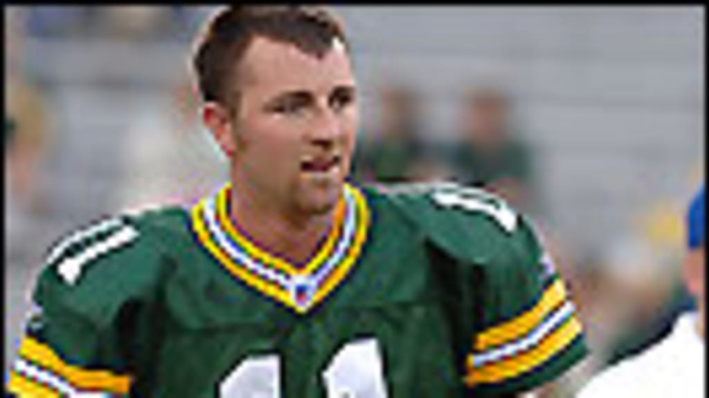 Green Bay Packers holder B.J. Sander watches as kicker Ryan