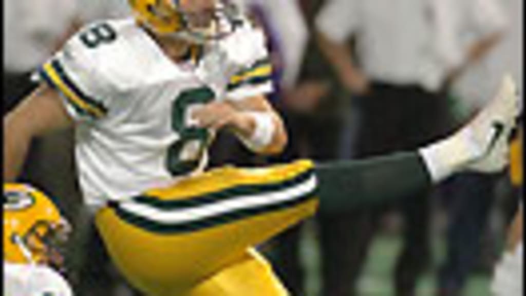 Green Bay Packers holder B.J. Sander watches as kicker Ryan