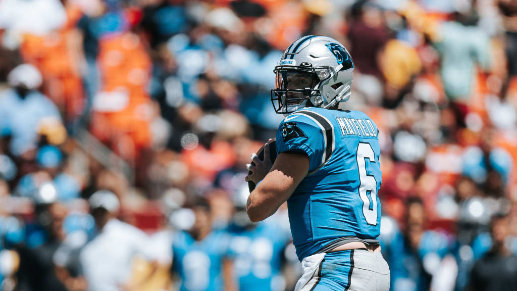 Carolina Panthers running back Chuba Hubbard (30) takes a handoff