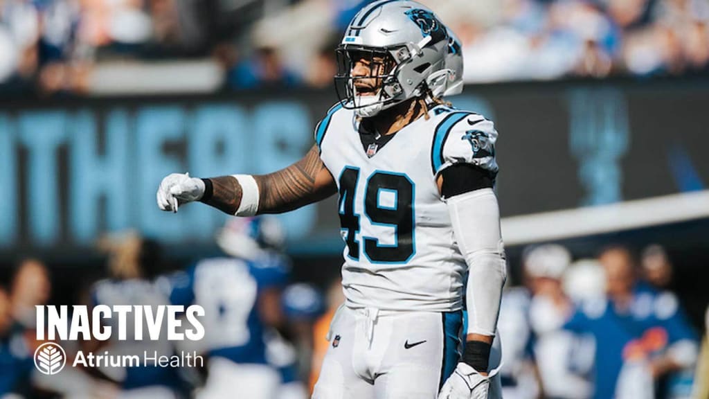 Carolina Panthers defensive tackle Marquan McCall (left) exchanges