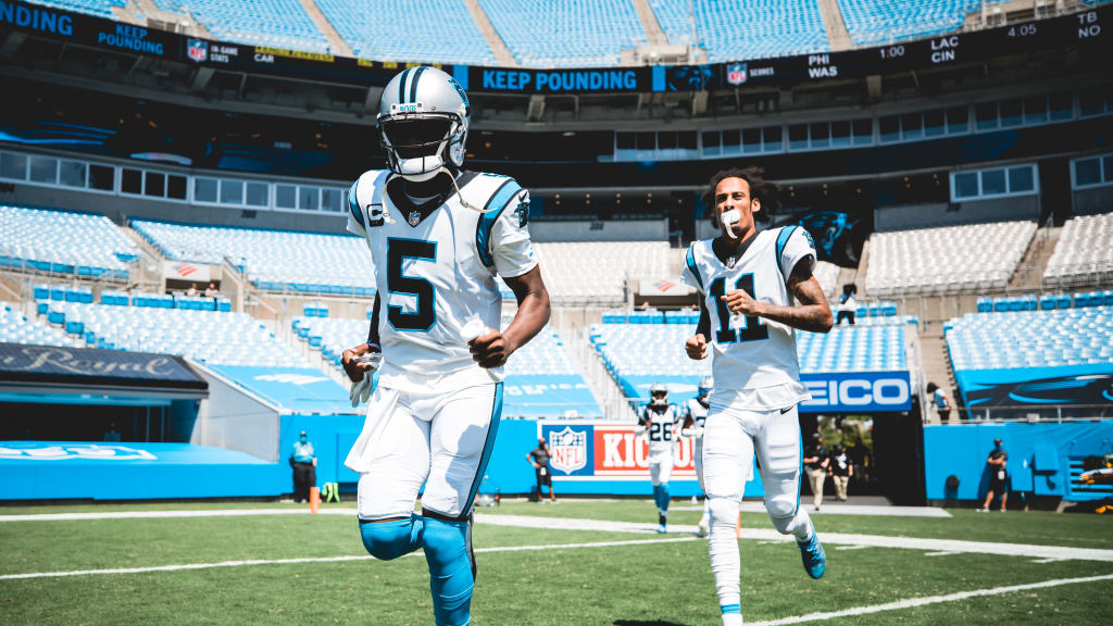 Los Angeles Chargers cornerback Chris Harris (25) chases Carolina Panthers  wide receiver Robby Anderson (11) after an Anderson catch and run during  the second half of an NFL football game Sunday, Sept.