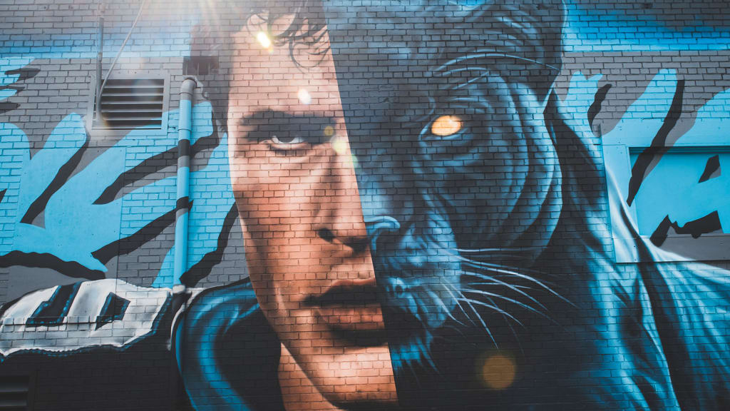 Luke Kuechly reacts to the stunning mural created by local artists