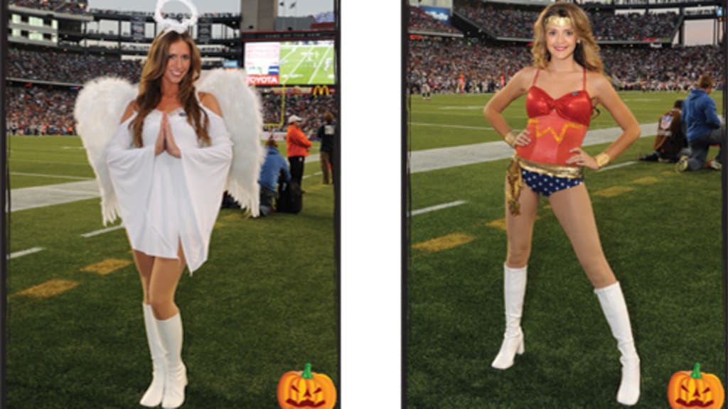 An Arizona Cardinals cheerleader performs in a Halloween costume