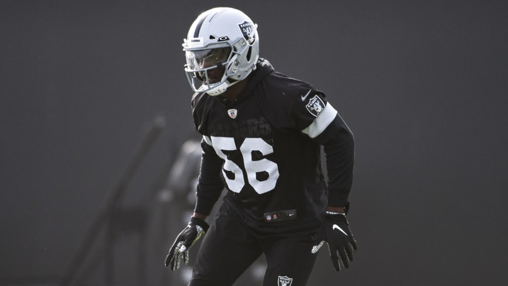 Raiders tight end Foster Moreau (87) is tackled by Raiders linebacker Javin  White (53) during a …