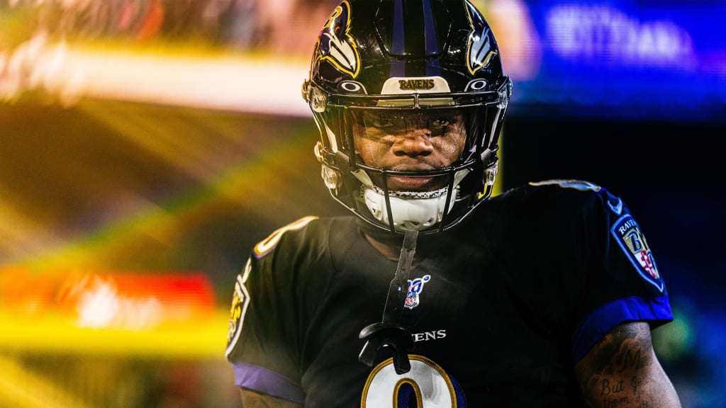 Baltimore Ravens quarterback Lamar Jackson looking downfield during a play "pictured here"