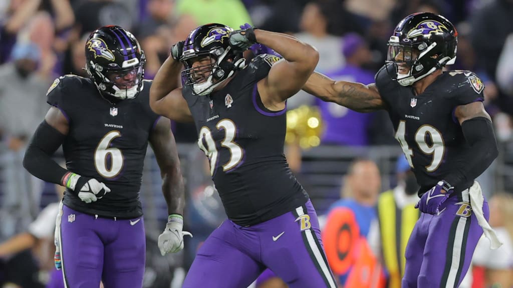 The Baltimore Ravens' Ray Lewis, left, fires up teammate Chris