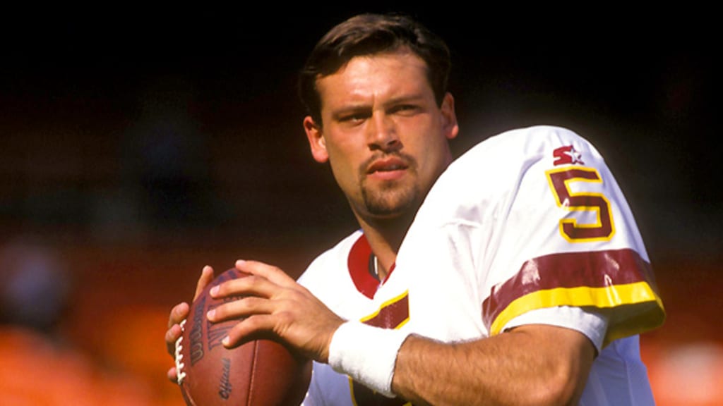 FILE ** Washington Redskins quarterback Heath Shuler puts his hand to his  helmet during the Redskins 14-7 loss to the Philadelphia Eagles in this  Nov. 26, 1995 photo at RFK Stadium