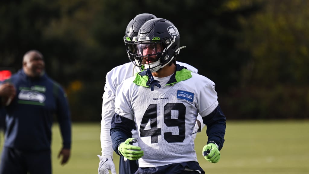 Travis Homer of the Seattle Seahawks runs with the ball in the second