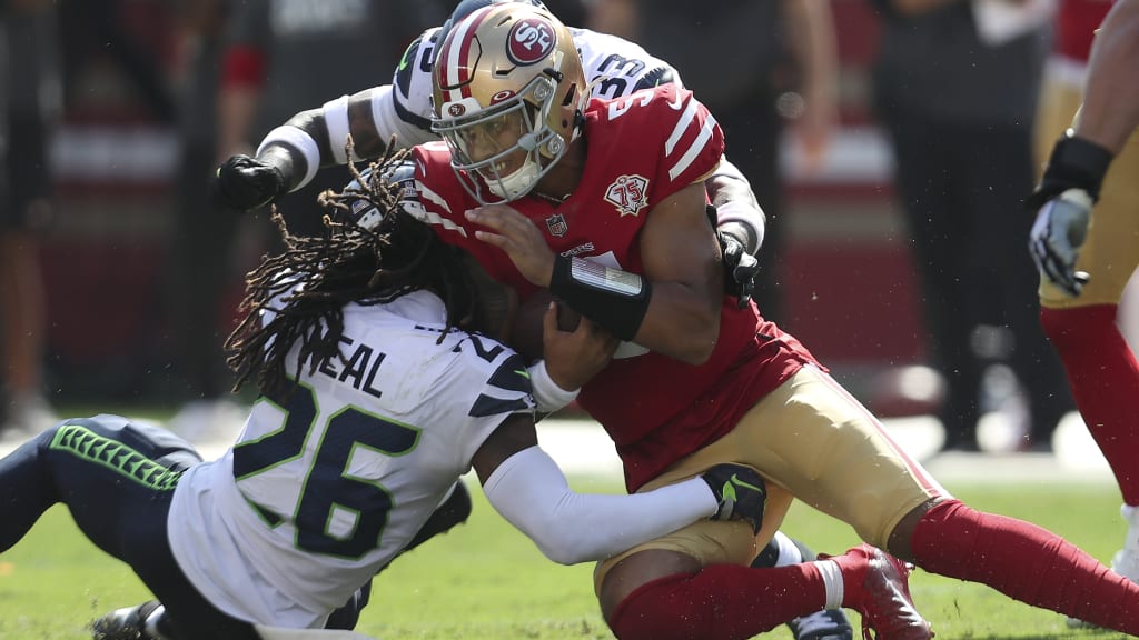 Trey Lance of the San Francisco 49ers passes against Malcolm