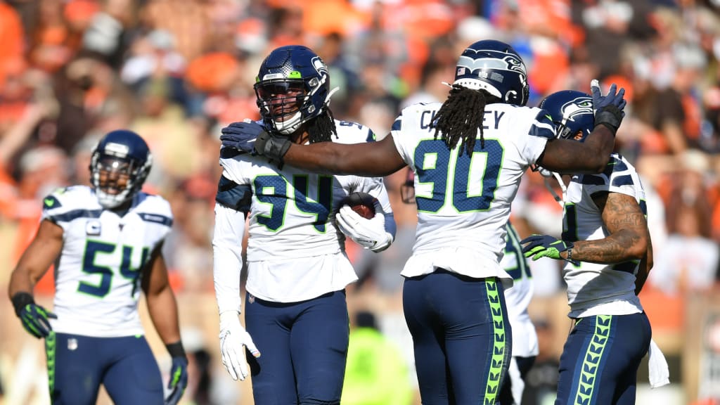 Seattle Seahawks head coach Pete Carroll, center, huddle with defensive  coordinator Ken Norton and defensive captain, Seattle Seahawks middle  linebacker Bobby Wagner (54) during the fourth quarter against the Arizona  Cardinals at