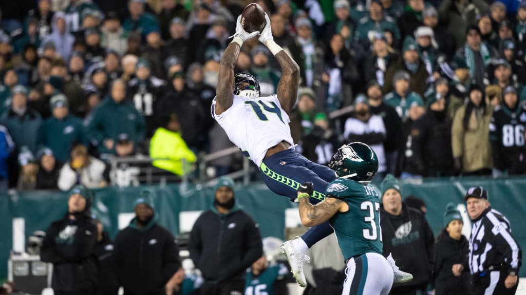 DK Metcalf of the Seattle Seahawks reacts after diving to make a