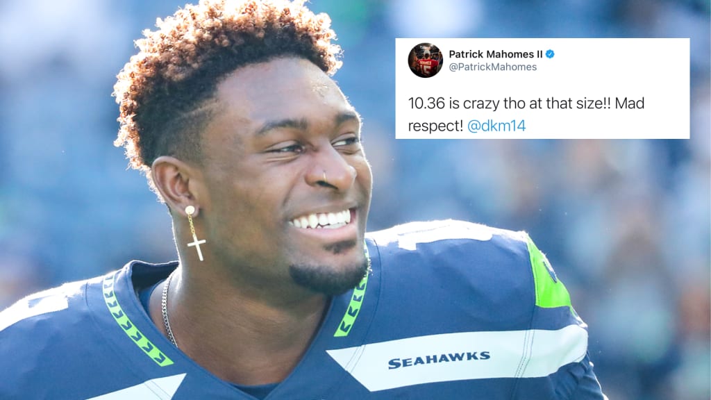 DK Metcalf of the Seattle Seahawks reacts after diving to make a