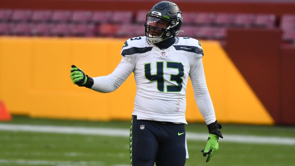 Seattle Seahawks' Carlos Dunlap on Russell Wilson: 'He told me he's with us  and he's here to stay' 