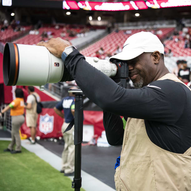 Ken Griffey Jr. Is a photographer at the Arizona Cardinals game