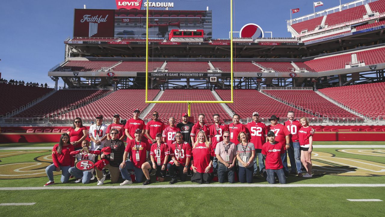 A flag is presented on the field of Levi's Stadium during the