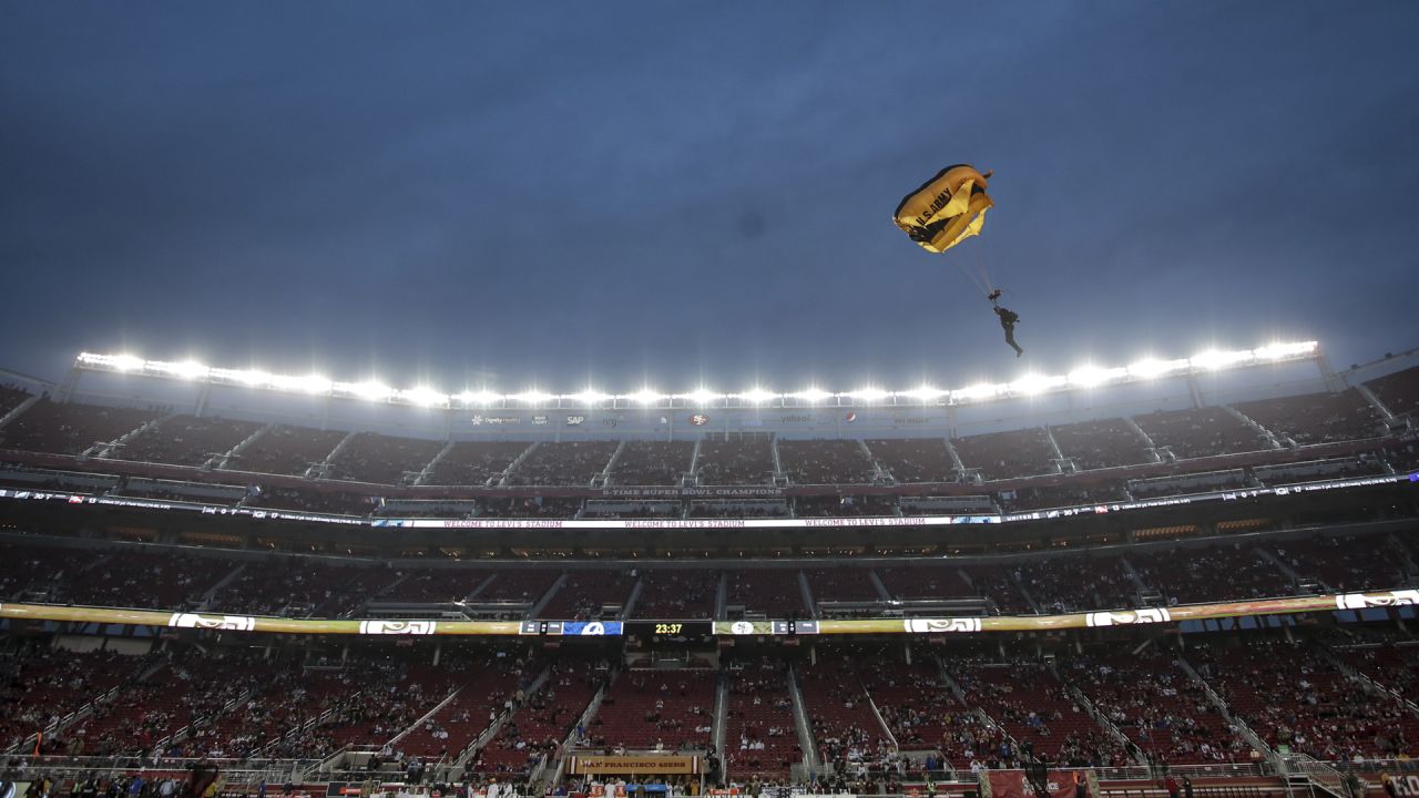 A member of the U.S. Army Golden Knights Parachute team performs a  demonstration prior to the San Francisco 49'ers Salute to Service game Nov.  13, 2022, at Levi's Stadium, Santa Clara, California.