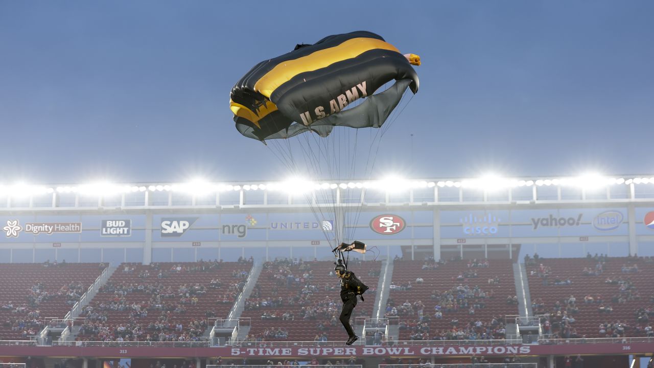 The Golden Knights parachute into the Levis Stadium before the